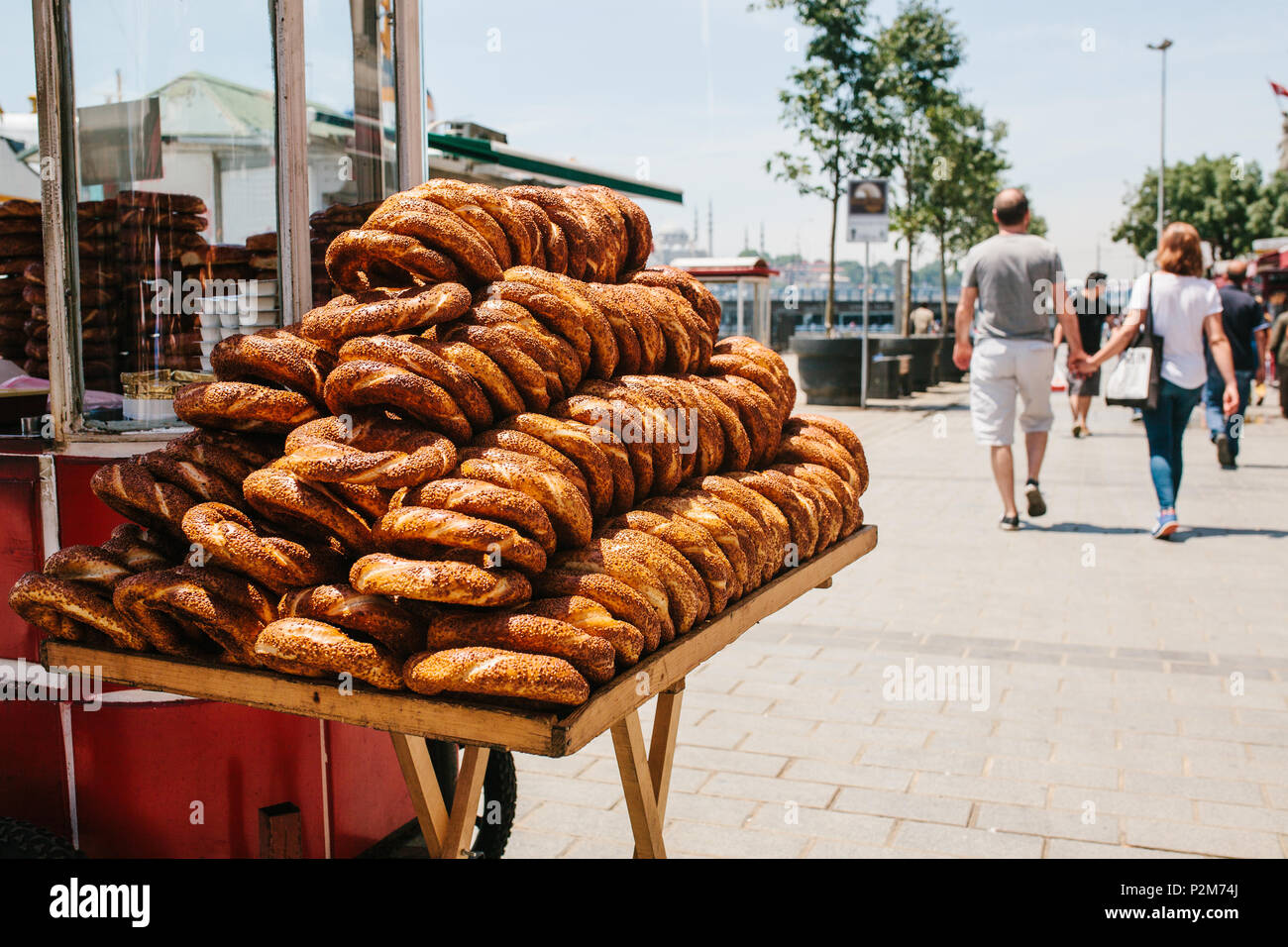 Group portrait of several young guys and one elderly man near stall with  turkish bagel at Taksim in Beyoglu, Istanbul Stock Photo - Alamy