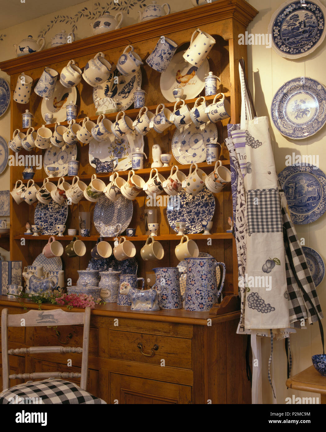https://c8.alamy.com/comp/P2MC9M/large-pine-dresser-with-collection-of-bluewhite-china-and-pottery-mugs-P2MC9M.jpg