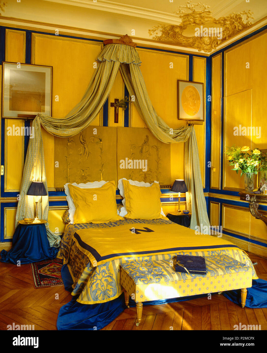 Coronet With Cream Drapes Above Bed With Cream Blue Bedspread In