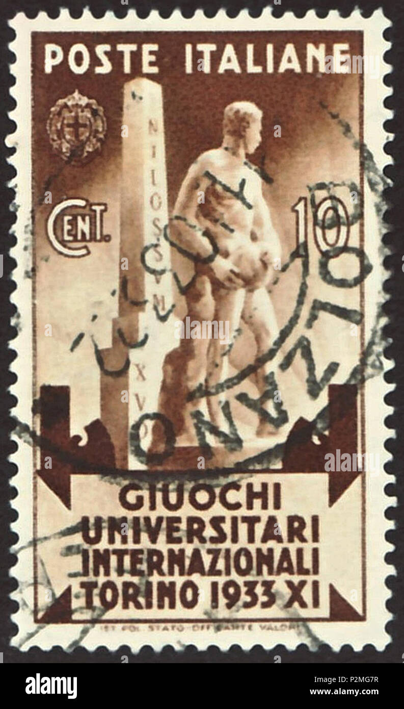 . Stamp of the Kingdom of Italy; 1933; commemorative stamp to the '5th International University Games' held in Turin in the time from 1 September 1933 until 10 September 1933; drawing of a statue of Benito Mussolini before an obelisk with inverted inscription 'INILOSSUM XUD' (= 'MUSSOLINI DUX' = 'The Leader Mussolini'); postmarked in Bolzano in 1933 The International University Sports Games were the precursor of the later staged Universiade (from 1959). Stamp: Michel: No. 448; Yvert & Tellier: No. 321; Scott: No. 306 Color: sepia to brown Watermark: Italy No. 1 (crown) Nominal value: 10 Cent.  Stock Photo
