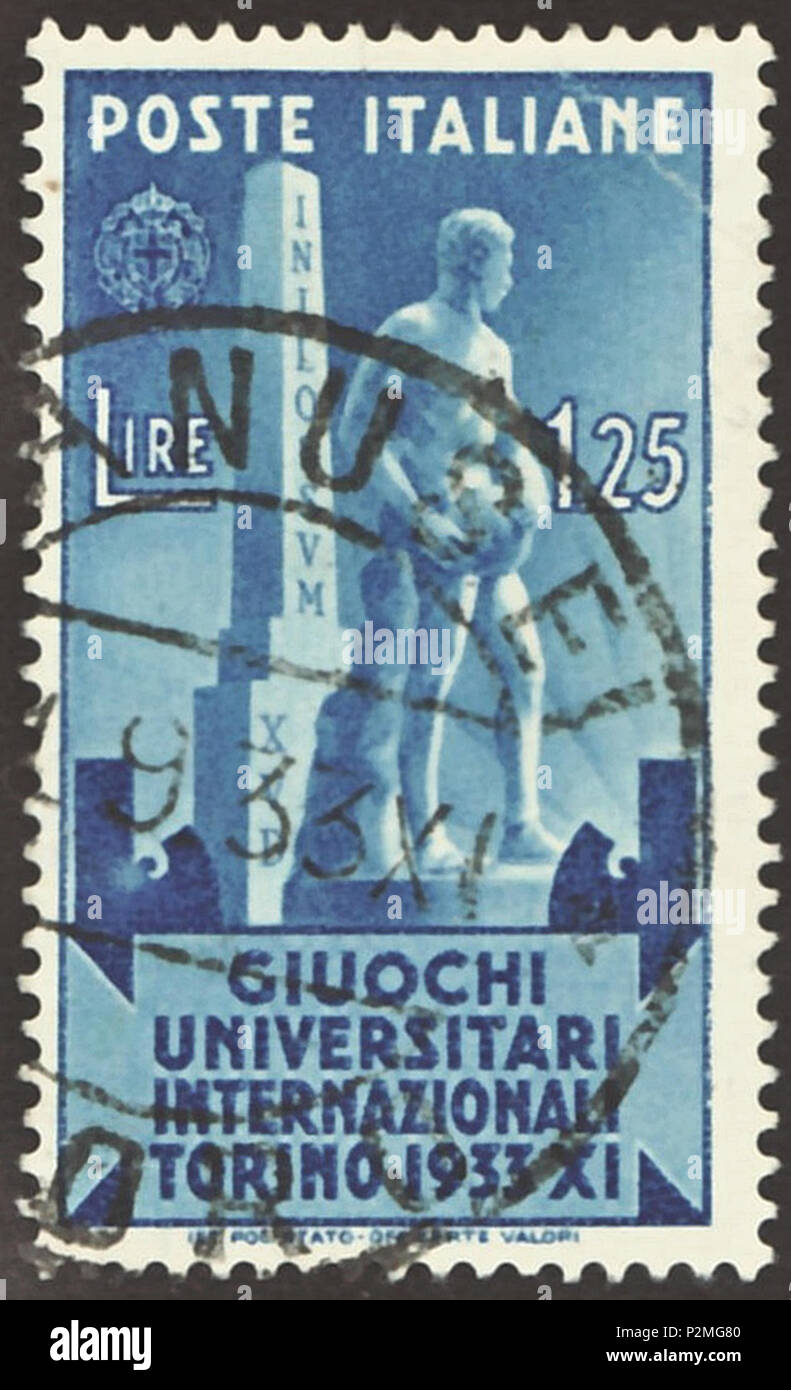 . Stamp of the Kingdom of Italy; 1933; commemorative stamp to the '5th International University Games' held in Turin in the time from 1 September 1933 until 10 September 1933; drawing of a statue of Benito Mussolini before an obelisk with inverted inscription 'INILOSSUM XUD' (= 'MUSSOLINI DUX' = 'The Leader Mussolini'); postmarked Lanusei in 1933 The International University Sports Games were the precursor of the later staged Universiade (from 1959). Stamp: Michel: No. 451; Yvert & Tellier: No. 324; Scott: No. 309 Color: azure to blue Watermark: Italy No. 1 (crown) Nominal value: 1.25 Lire (?) Stock Photo