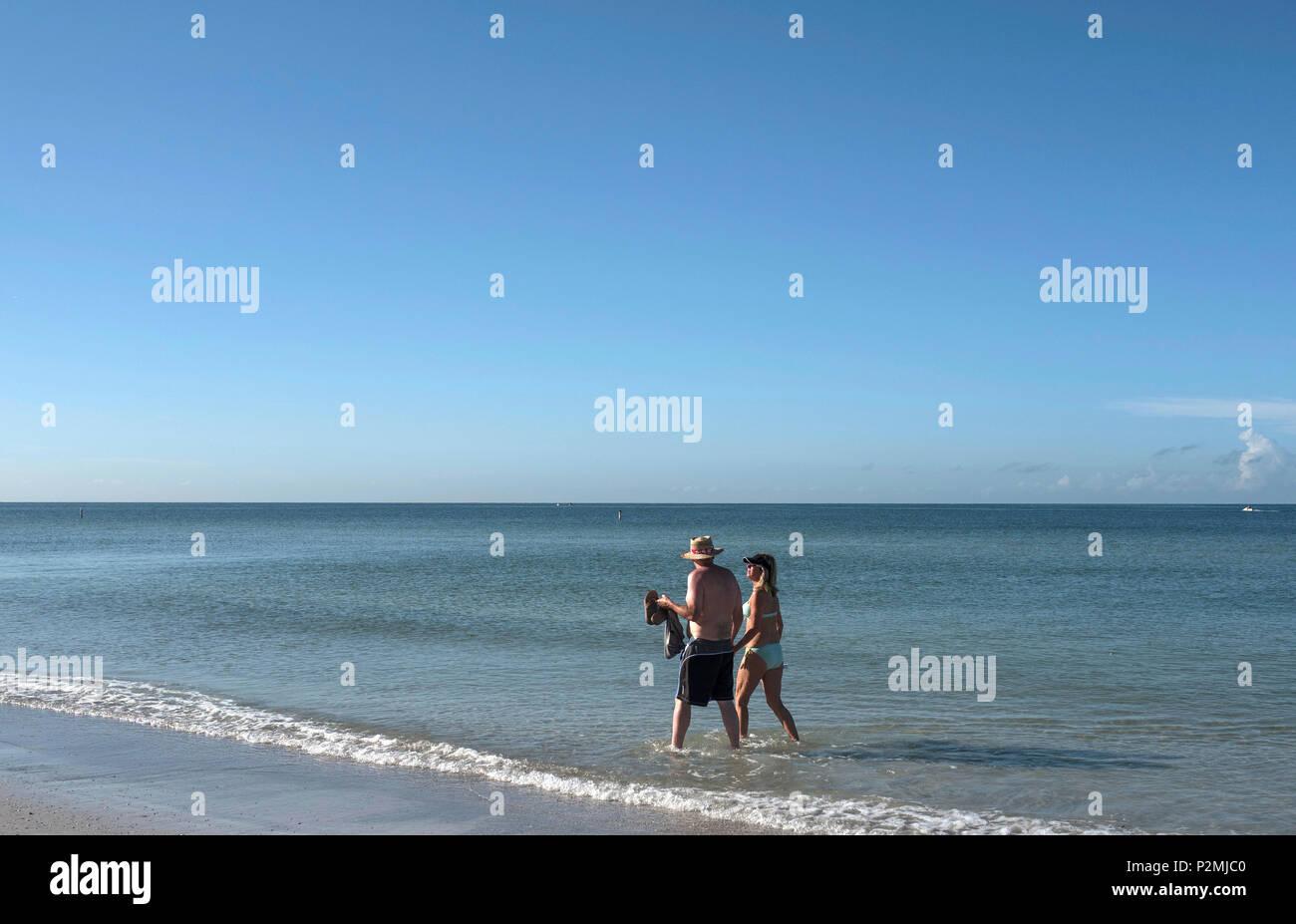 Redington Beach. Florida, USA,  general view of people enjoying Redington Shores beach. Walking sitting in the Sun, Gulf Mexico, Tuesday 04/10/2016, © Stock Photo