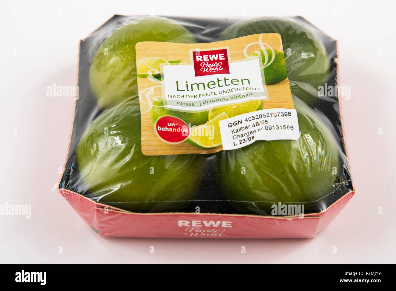 Fresh food, fruits, each individually packaged in plastic wrap, all food is available in the same supermarket even without plastic packaging, lime, Stock Photo