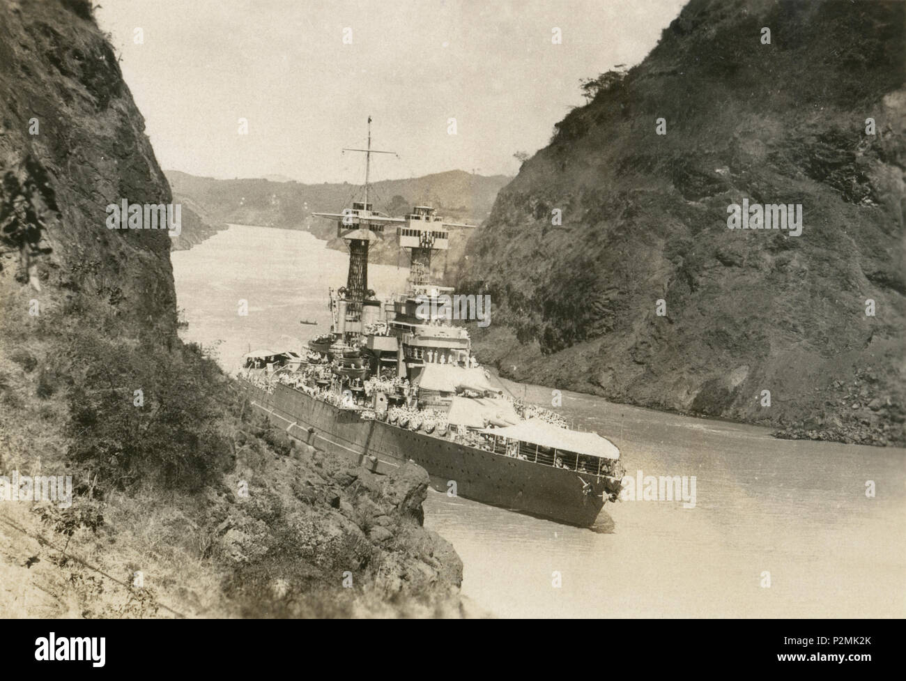 Antique February 13, 1923 photograph, USS Maryland (BB-46) in the Culebra Cut (formerly Gaillard Cut) in the Panama Canal. USS Maryland (BB-46), also known as 'Old Mary' or 'Fighting Mary' to her crewmates, was a Colorado-class battleship. SOURCE: ORIGINAL PHOTOGRAPH Stock Photo