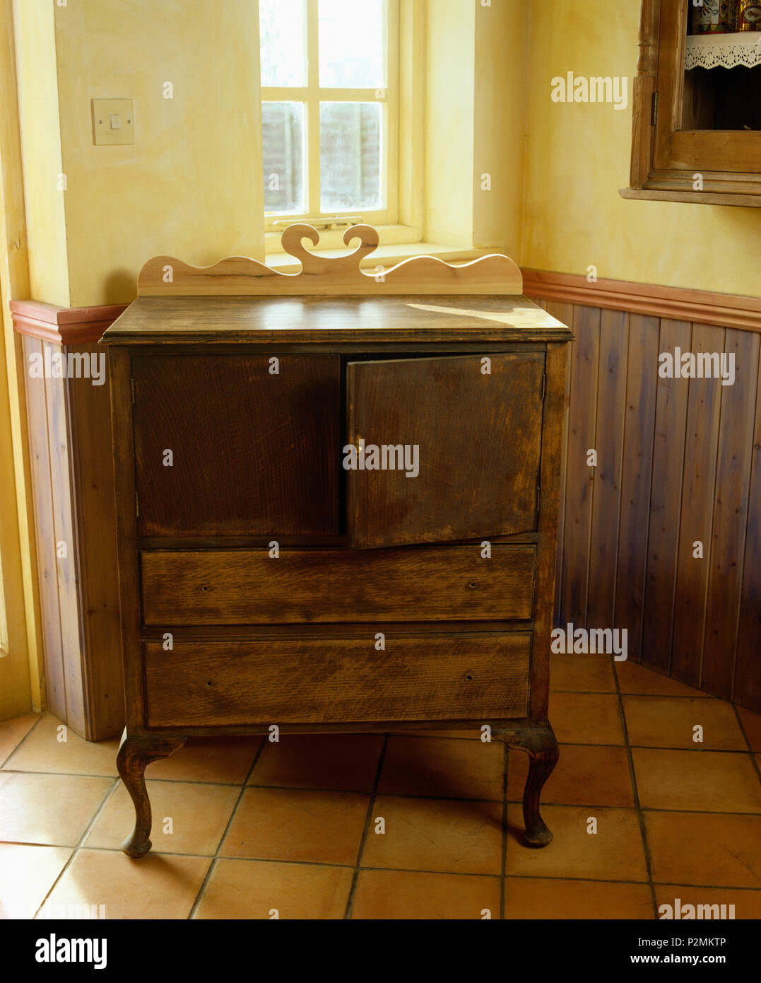 Old brown cupboard found in a second hand shop, before being repainted and given a new lease of life Stock Photo