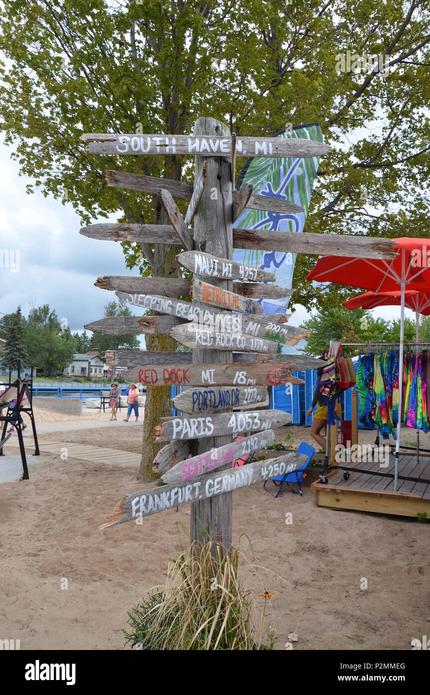 SOUTH HAVEN, MI / USA - AUGUST 12, 2017: MIlepost sign at South Haven beach on Lake Michigan, directs visitors. Stock Photo