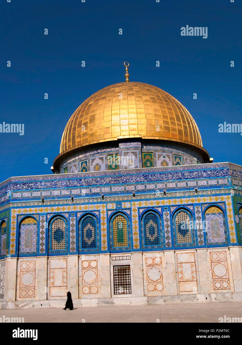 Israel, Palestine, Jerusalem, Dome of the Rock, a man walks in front of the Dome of the Rock, a sacred place of Islam where the Al-Aqsa mosque also stands Stock Photo