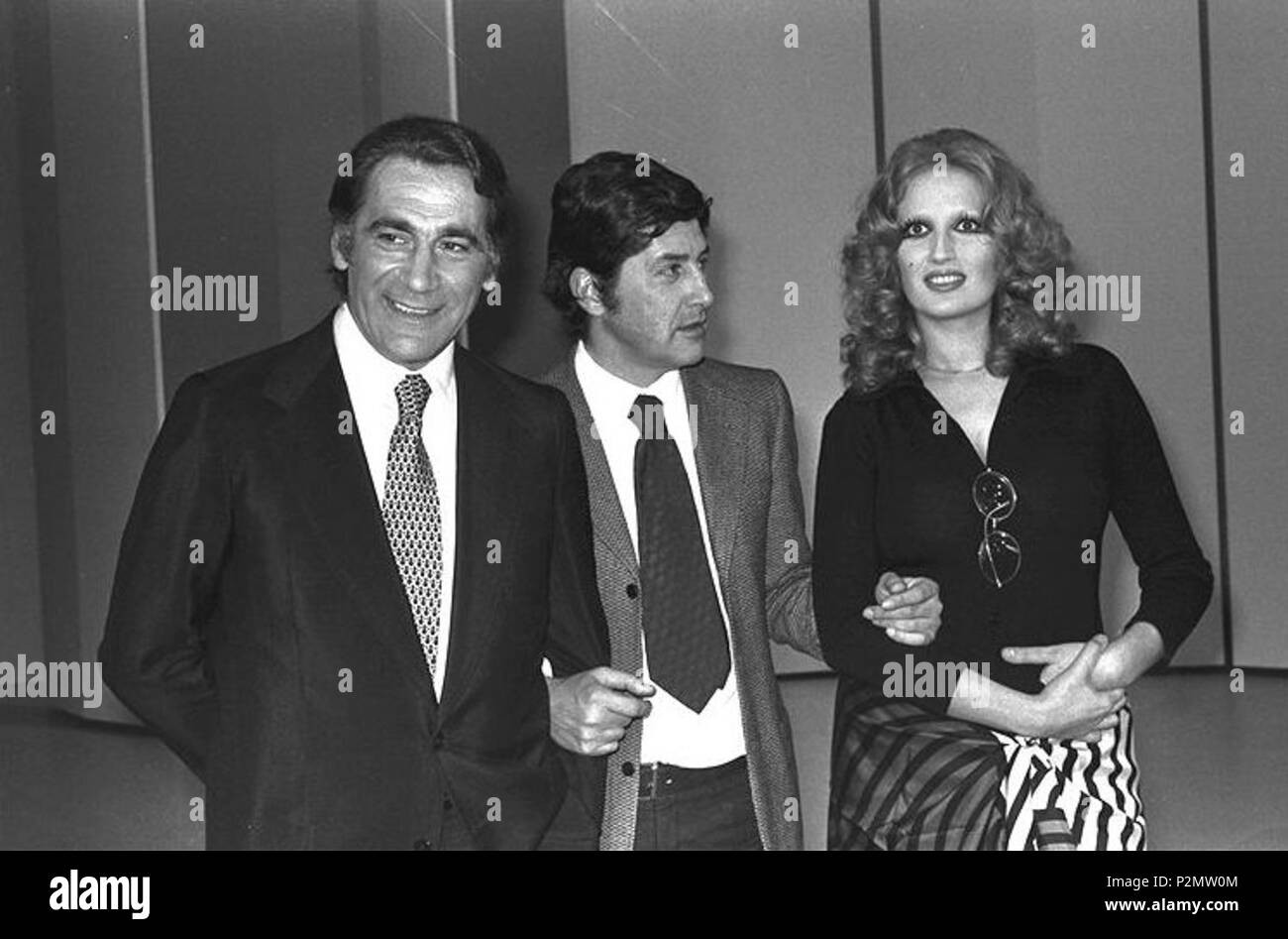 . From left to right the Italian actor Alberto Lupo, the director Antonello Falqui and the singer Mina. The former and the latter were presenters of Teatro 10, a TV show broadcast by RAI; Antonello Falqui was its director. 1972. Unknown 74 RAI Teatro 10 Alberto Lupo Antonello Falqui Mina 1972 Stock Photo