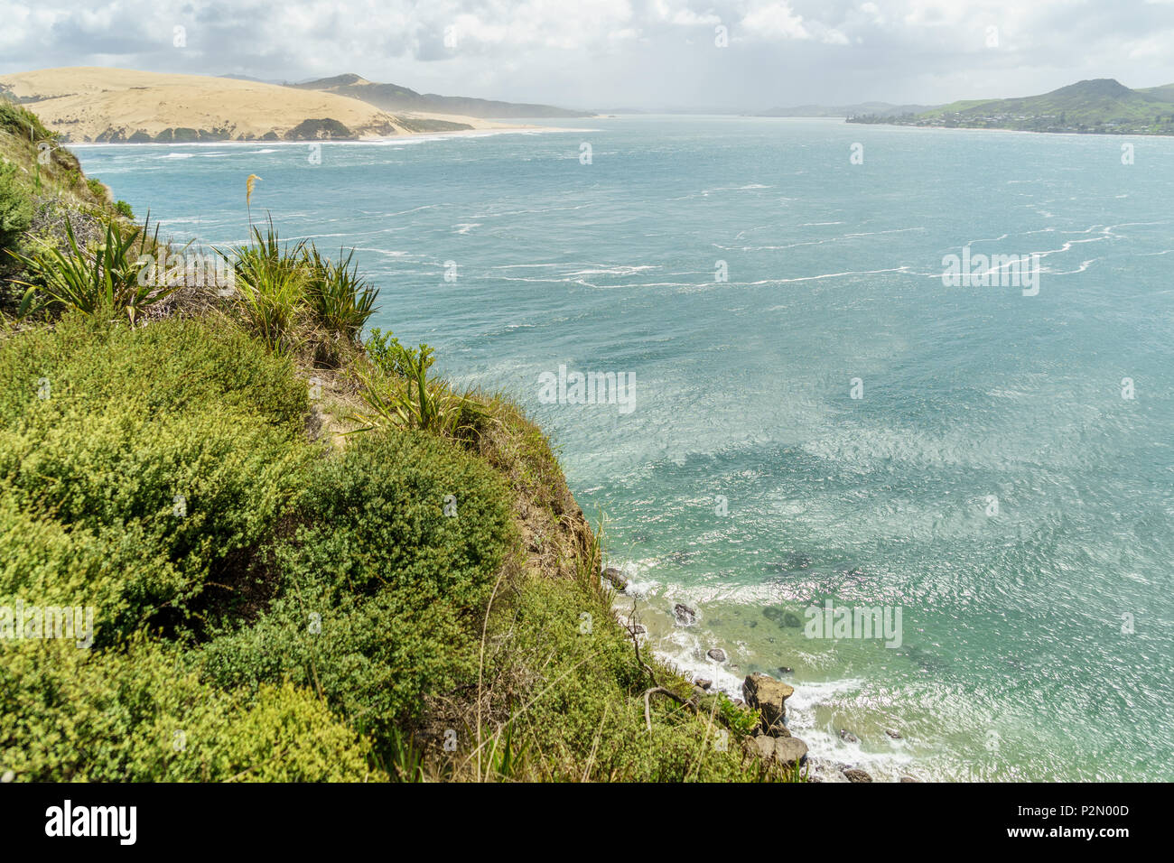 aerial view of beautiful ocean coastline on sunny day, Omapere, New Zealand Stock Photo