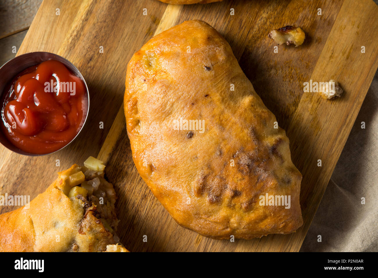 Homemade Upper MIchigan Pasty Meat Pie with Ketchup Stock Photo Alamy
