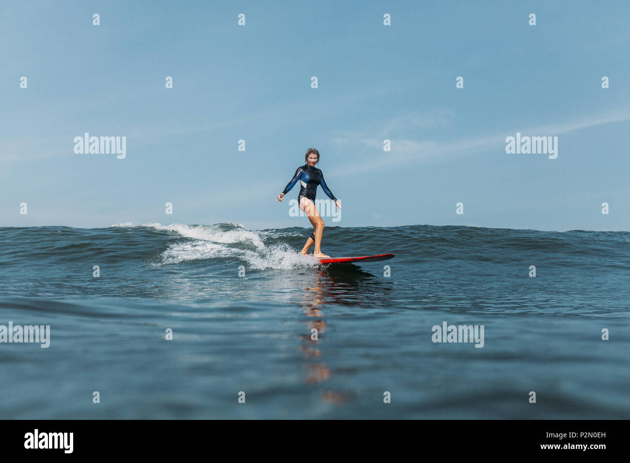 Surfer girl riding wave hi-res stock photography and images - Alamy