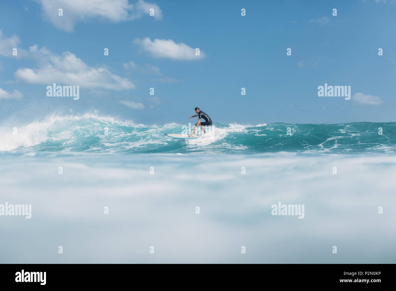 Man Riding Wave Man riding wave hi-res stock photography and images - Alamy