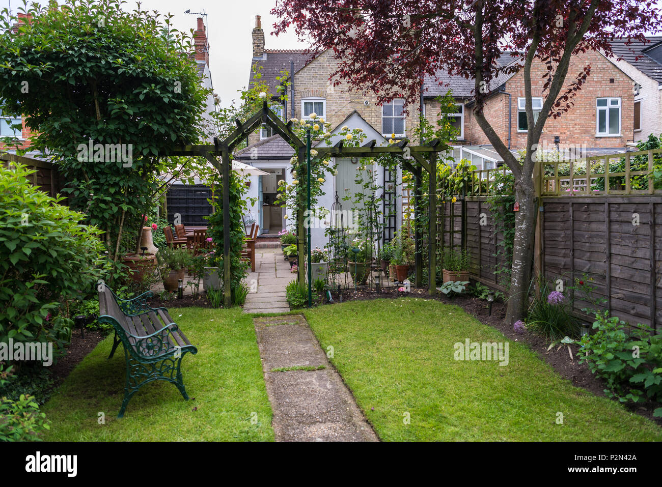Back garden and patio of a small English suburban house Stock ...