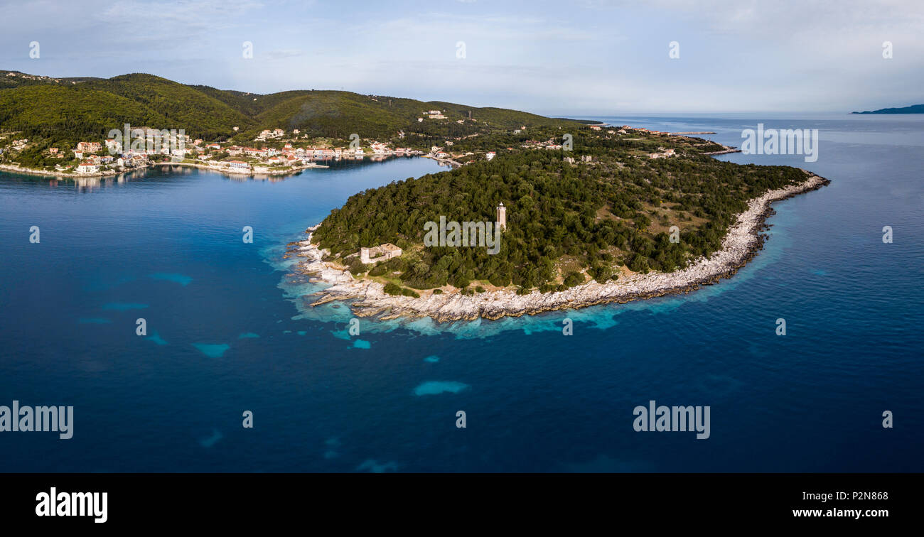 Aerial view of the Fiscardo fishing village and lighthouse on