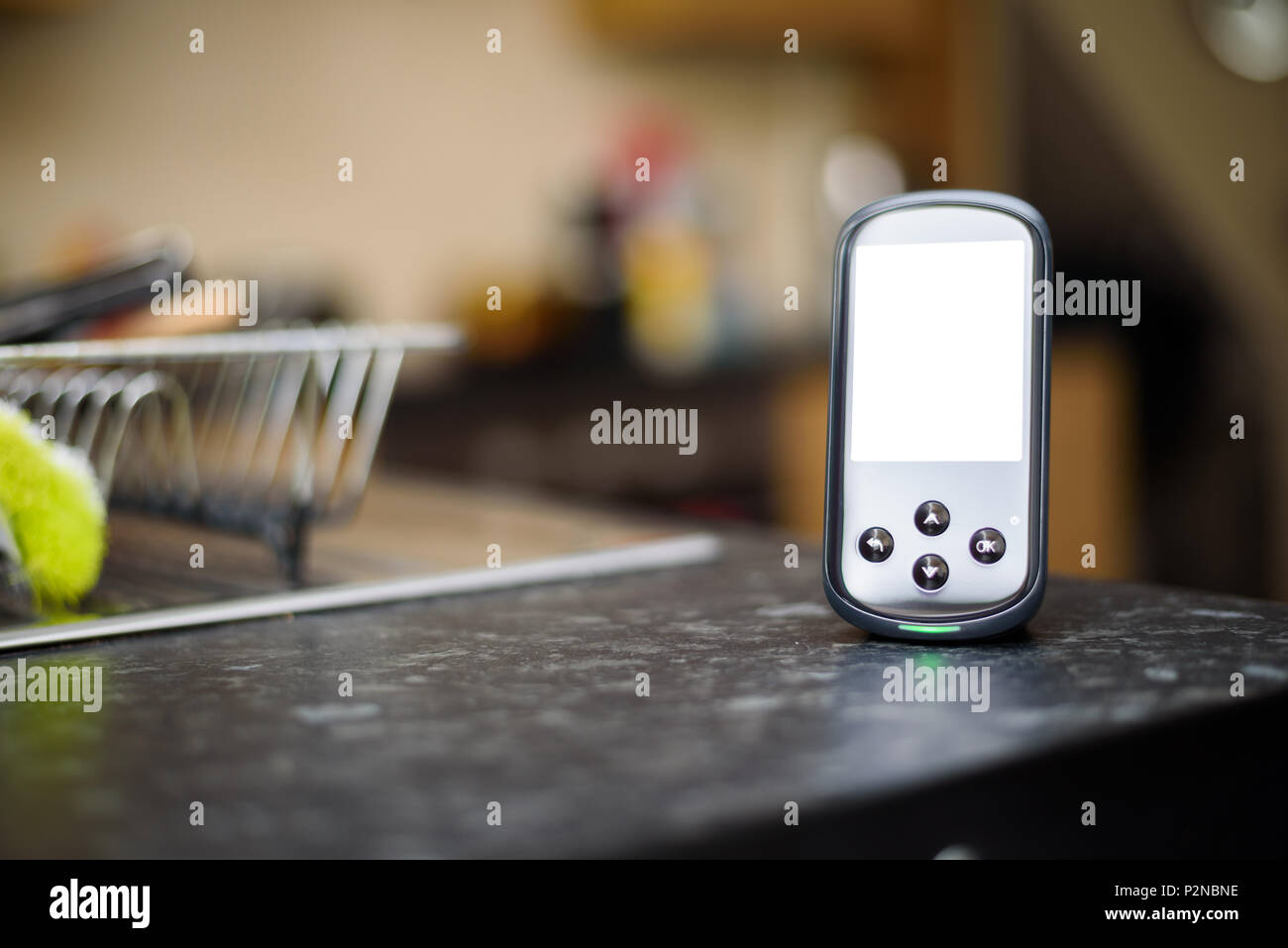 Domestic Energy Smart Meter on a Kitchen Worktop with a blank screen for copy space Stock Photo