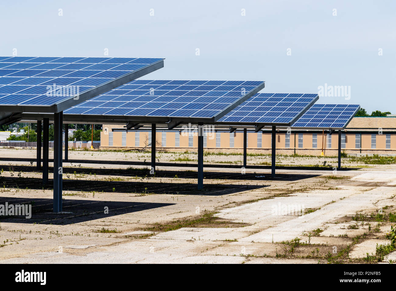 Solar Thermal Flat Panels providing shade in a patking lot. Many companies are installing renewable energy sources to reduce their carbon footprint I Stock Photo