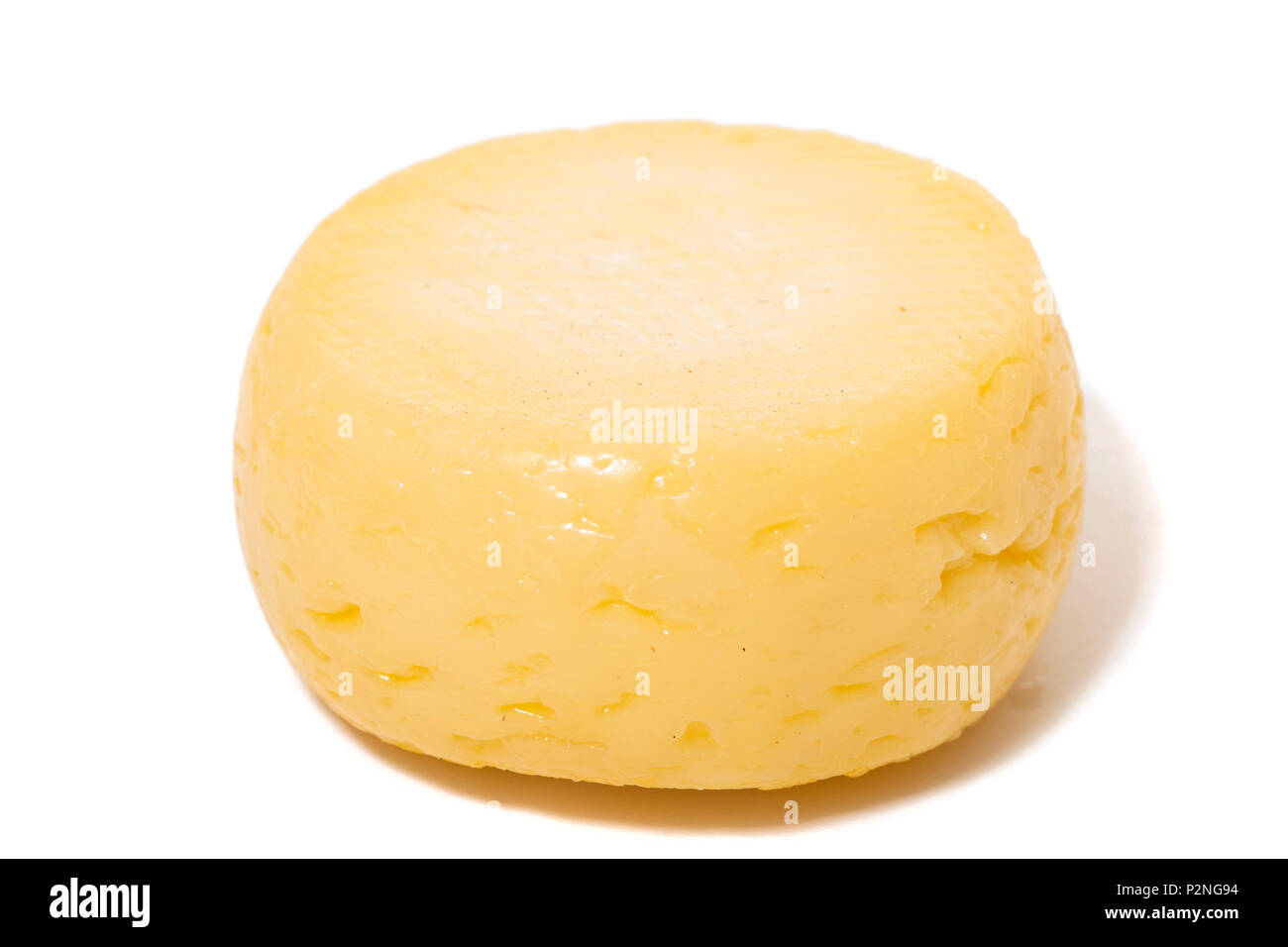 Yellow goat cheese isolated on a white background Stock Photo Alamy