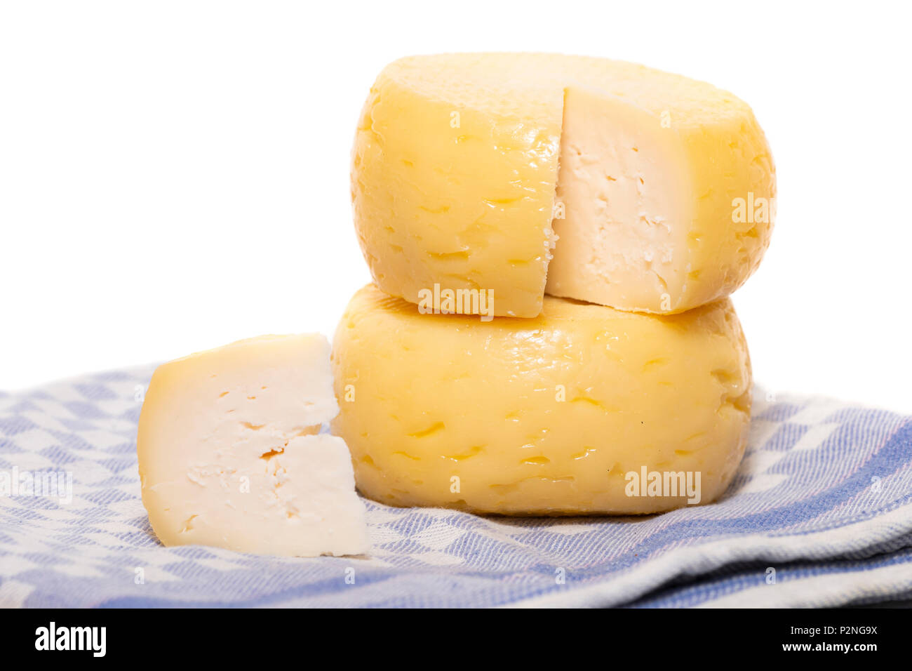 Yellow goat cheese isolated on a white background Stock Photo Alamy