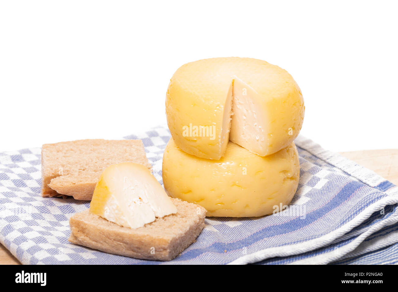 Yellow goat cheese isolated on a white background Stock Photo Alamy