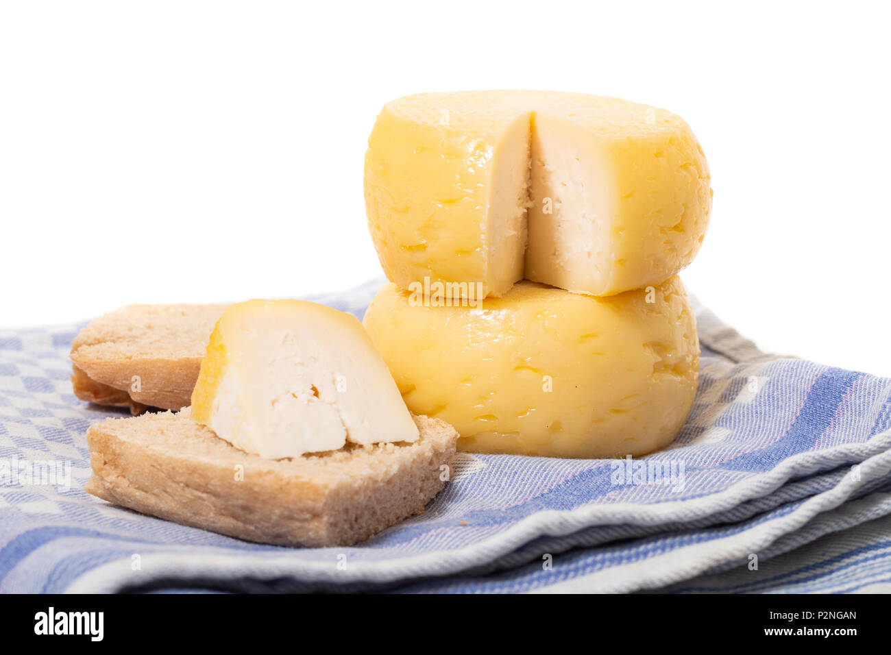 Yellow goat cheese isolated on a white background Stock Photo Alamy