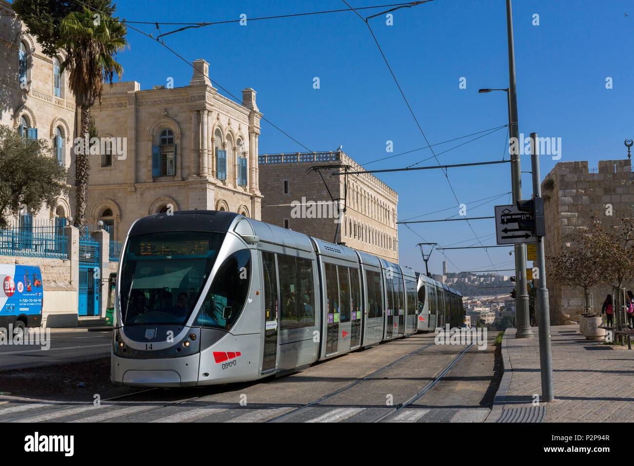 Israel, Jerusalem, at the gateway to the UNESCO-protected Old Town, the light railcar, built by the French companies Alstom and Veolia, in the background the French hospital Saint-Louis Stock Photo