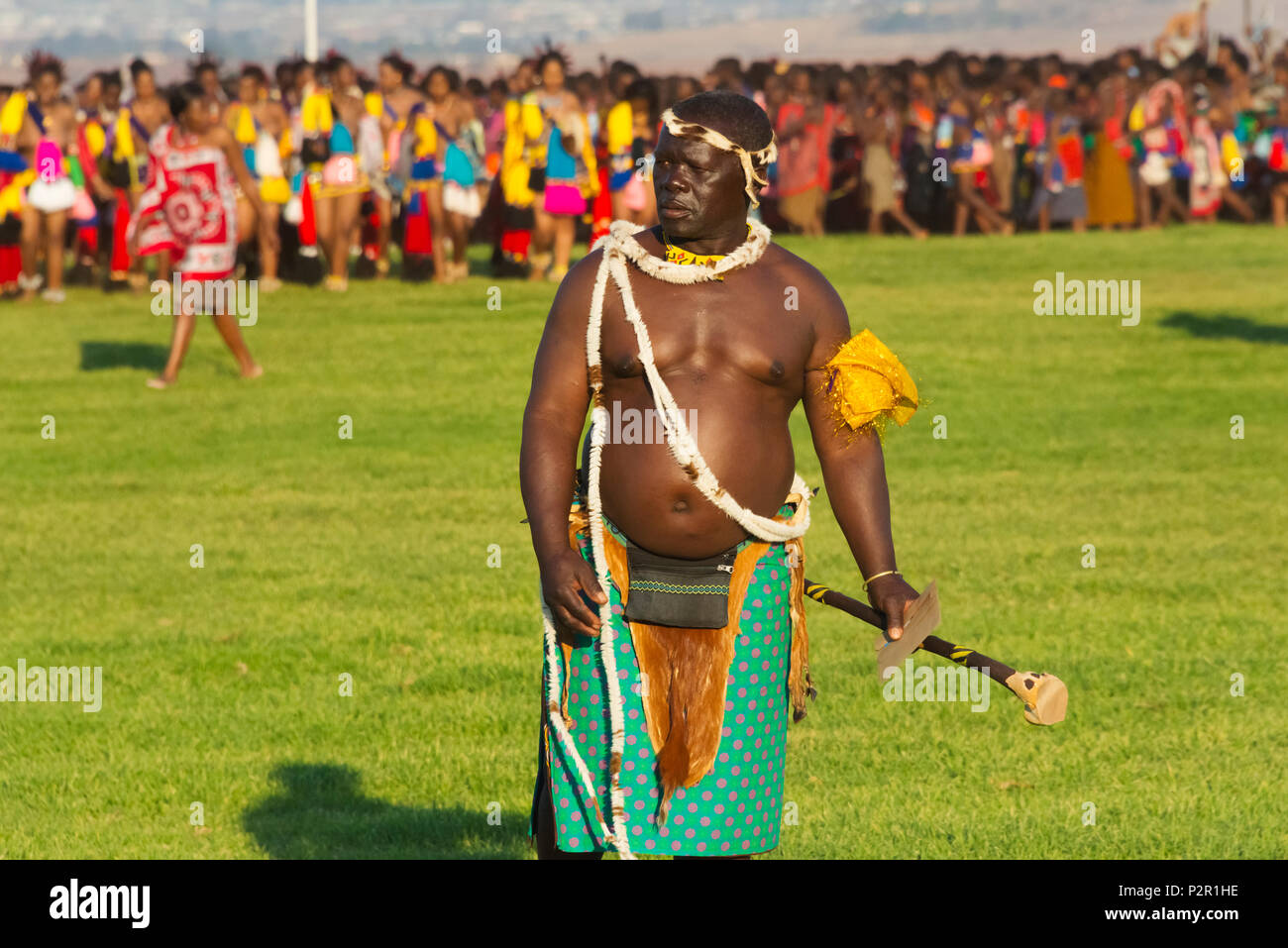 Swazi man with girls parade at Umhlanga (Reed Dance Festival), Swaziland Stock Photo
