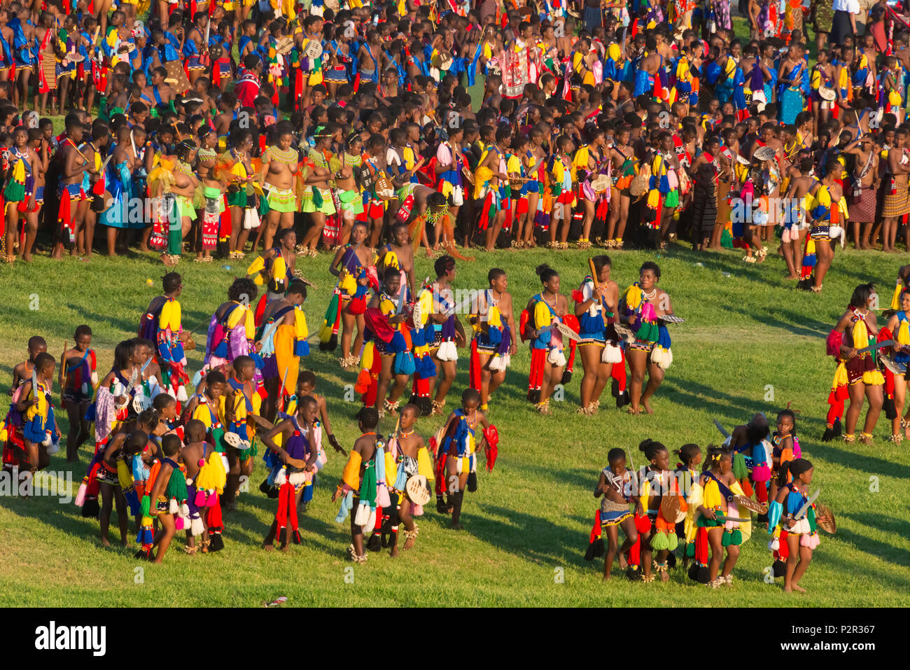 Swazi girls carrying sword parade at Umhlanga (Reed Dance Festival), Swaziland Stock Photo