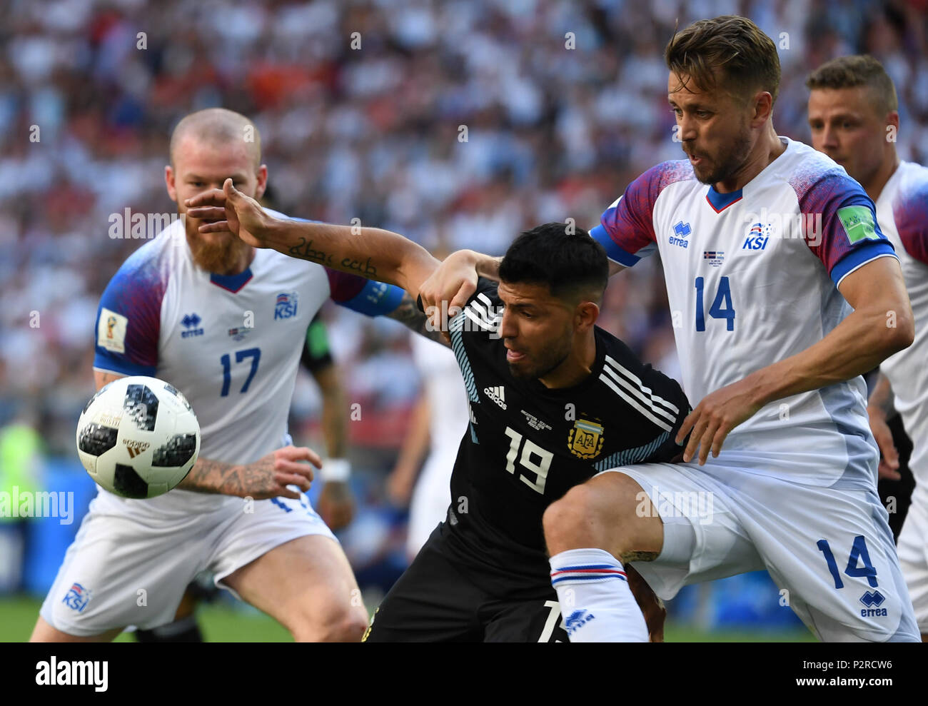 Moscow, Russia. 16th Jun, 2018. Moscow, Russia. 16 June 2018, Russia, Moscow, Soccer, FIFA World Cup 2018, Group D, Matchday 1 of 3, Argentina vs Iceland at the Spartak Stadium: Sergio Agüero from Argentina (C) fights for the ball against Aron Einar Gunnarsson (L) and Kari Arnason from Iceland. Photo: Federico Gambarini/dpa Credit: dpa picture alliance/Alamy Live News Stock Photo