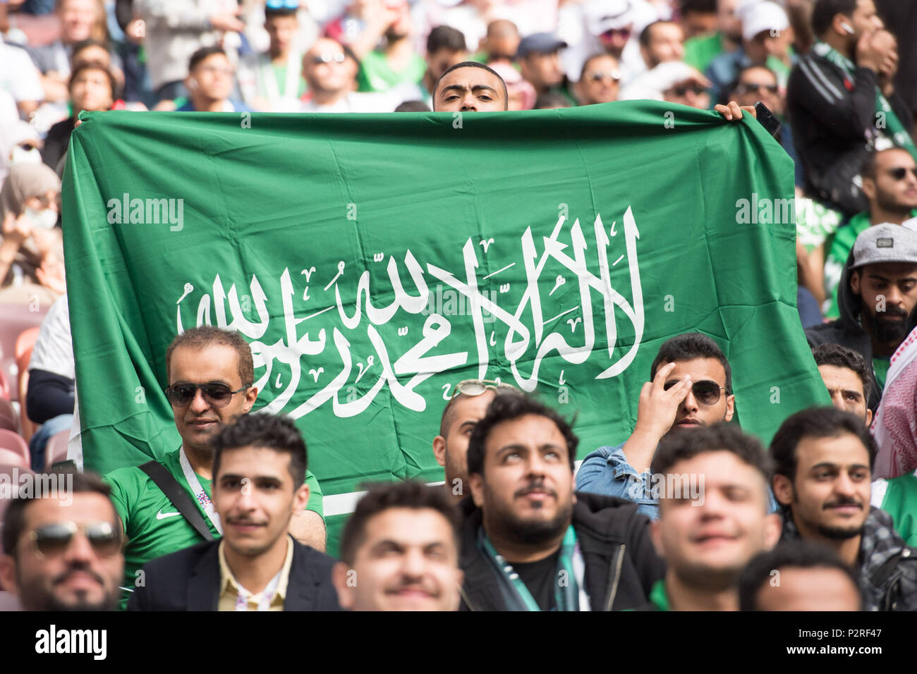 A fan holds up the Saudi Arabian flag, Fan, Fans, Spectators, Trailers,  Supporters, Feature, General, Edge motif, Russia (RUS) - Saudi Arabia (KSA)  5: 0, Preliminary Round, Group A, Game 1, am