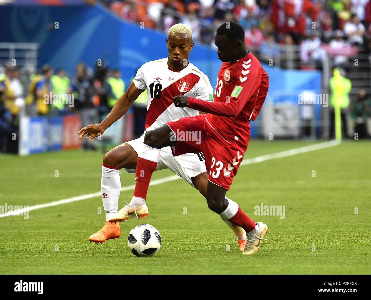 Saransk, Russia. 16th June, 2018. Andre Carrillo (L) of Peru vies with Pione Sisto of Denmark during a group C match between Peru and Denmark at the 2018 FIFA World Cup in Saransk, Russia, June 16, 2018. Credit: He Canling/Xinhua/Alamy Live News Stock Photo