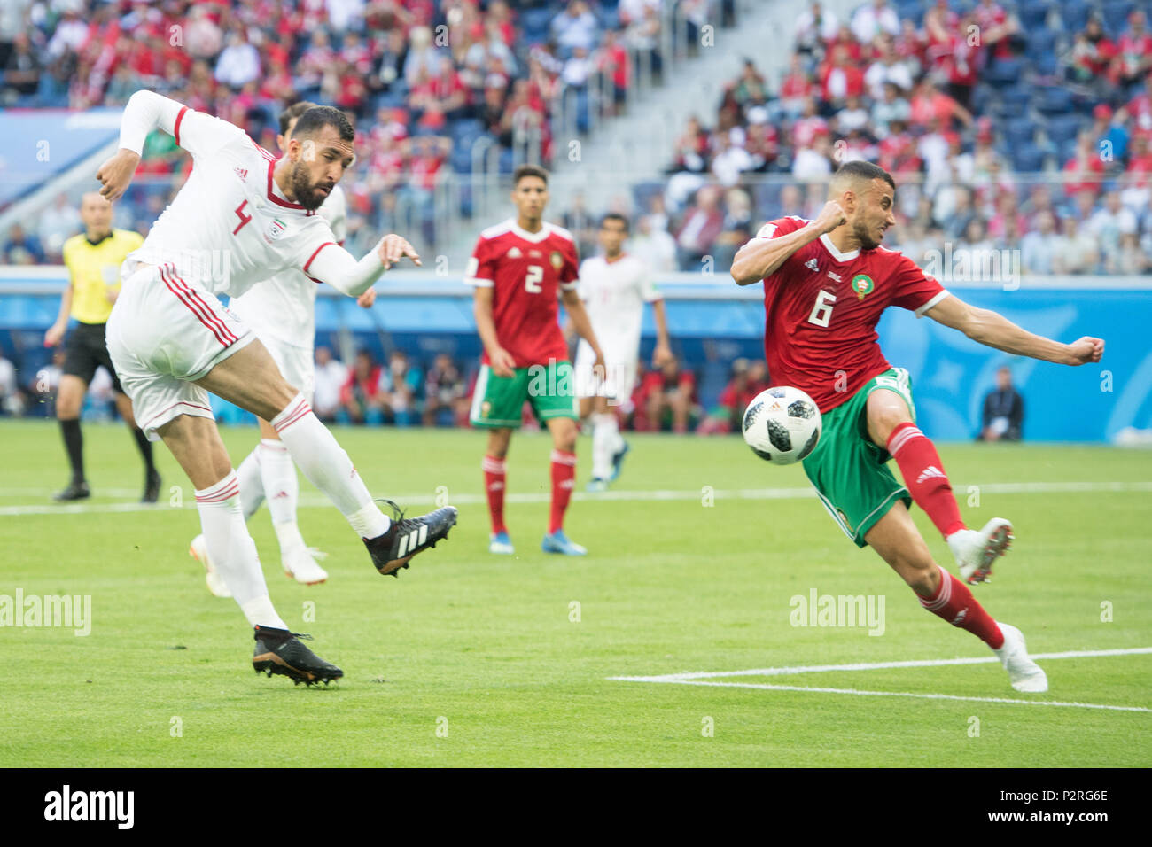 Roozbeh CHESHMI (left, IRN) versus Romain SAISS (MAR), action, duels, Morocco (MAR) - Iran (IRN) 0: 1, preliminary round, group B, match 4, on 15.06.2018 in St.Petersburg; Football World Cup 2018 in Russia from 14.06. - 15.07.2018. | usage worldwide Stock Photo