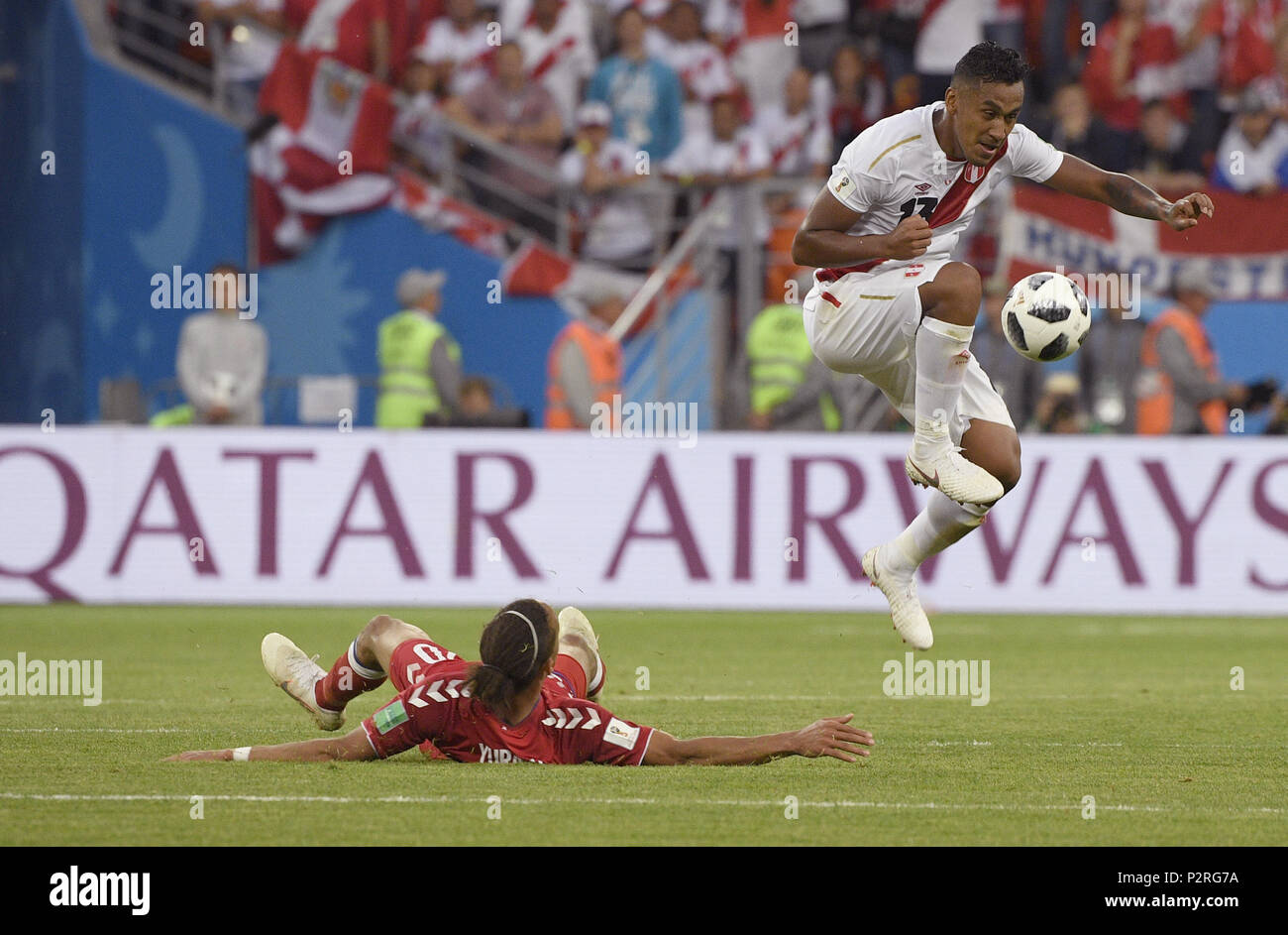 Saransk, Russia. 16th June, 2018. Renato Tapia (R) of Peru breaks through with the ball during a group C match between Peru and Denmark at the 2018 FIFA World Cup in Saransk, Russia, June 16, 2018. Credit: Lui Siu Wai/Xinhua/Alamy Live News Stock Photo