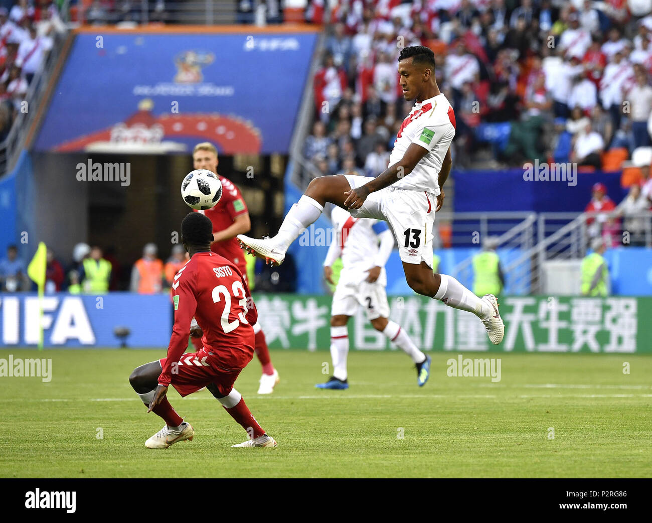 Saransk, Russia. 16th June, 2018. Renato Tapia (top) of Peru competes during a group C match between Peru and Denmark at the 2018 FIFA World Cup in Saransk, Russia, June 16, 2018. Credit: He Canling/Xinhua/Alamy Live News Stock Photo