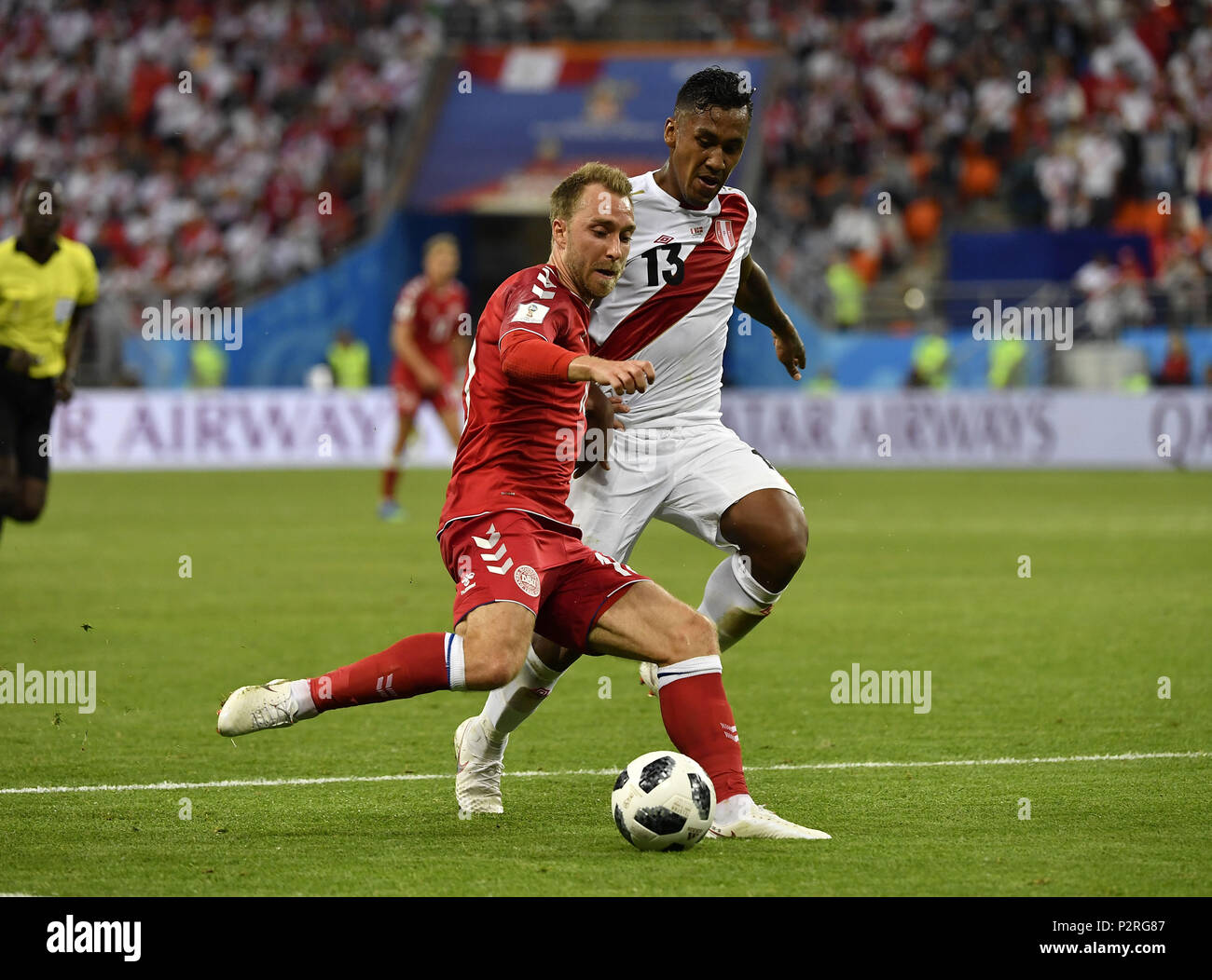 Saransk, Russia. 16th June, 2018. Christian Eriksen (L) of Denmark vies with Renato Tapia of Peru during a group C match between Peru and Denmark at the 2018 FIFA World Cup in Saransk, Russia, June 16, 2018. Credit: He Canling/Xinhua/Alamy Live News Stock Photo