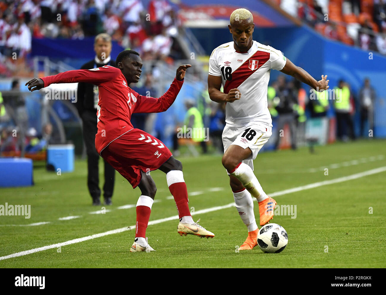 Saransk, Russia. 16th June, 2018. Andre Carrillo (R) of Peru vies with Pione Sisto of Denmark during a group C match between Peru and Denmark at the 2018 FIFA World Cup in Saransk, Russia, June 16, 2018. Denmark won 1-0. Credit: He Canling/Xinhua/Alamy Live News Stock Photo