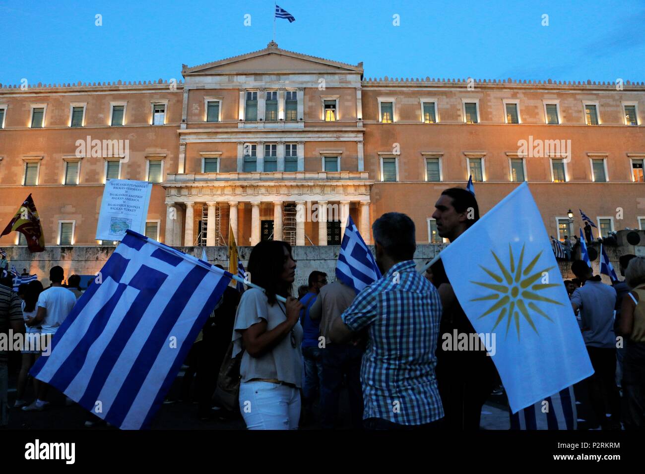Demonstrators seen holding flags in front of the Greek parliament building. Big Demonstration in Syntagma as Greeks demand from the parliament to not vote yes at an agreement about the Macedonia Naming Dispute. Credit: SOPA Images Limited/Alamy Live News Stock Photo