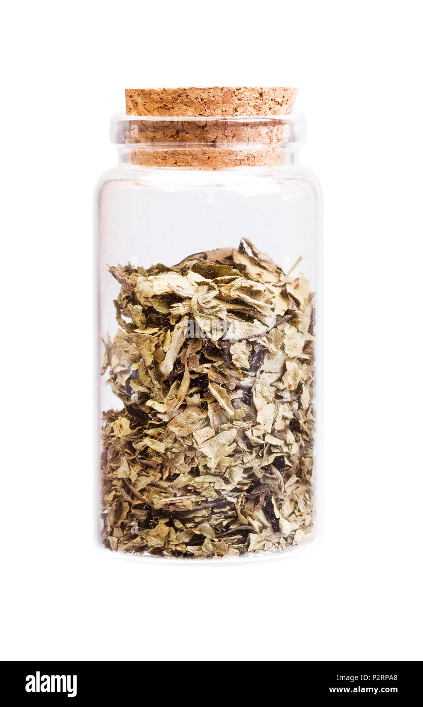Medicinal herb in a bottle with cork stopper for medical use. Stock Photo