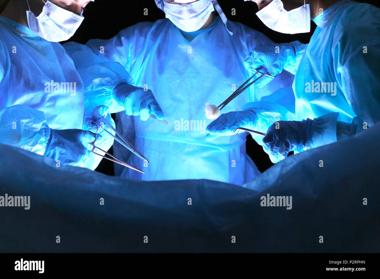 Group of surgeons in masks performing operation. Medicine, surgery and ...