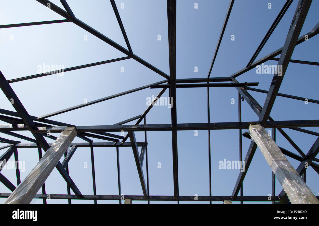 Steel structure with blue sky background Stock Photo - Alamy