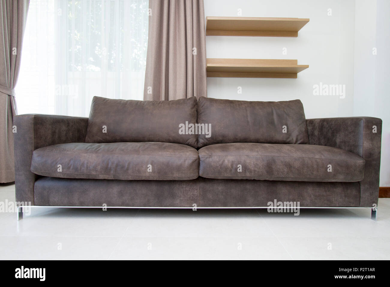 Leather sofa in modern living room Stock Photo - Alamy