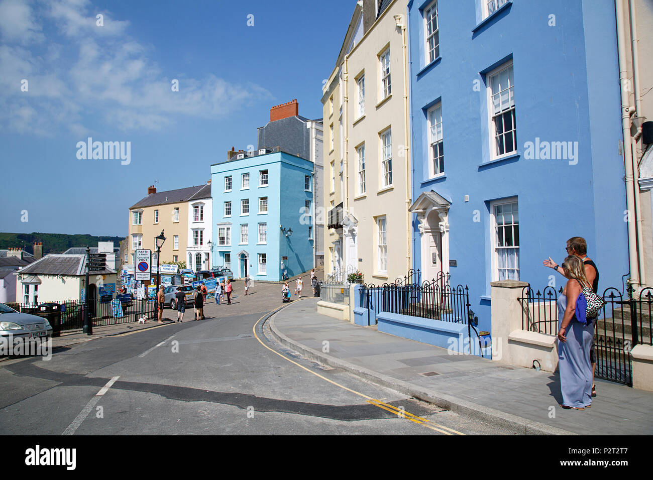 Tenby, UK: June 11, 2018: Tenby is a harbour town and resort in Wales with 13th-century town walls and beautiful Georgian era houses and hotels. Stock Photo