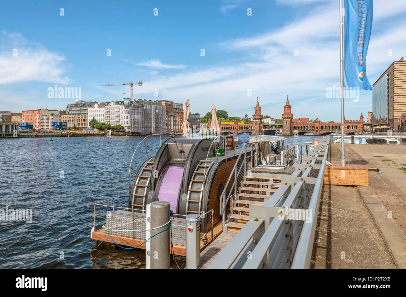Modern Houseboat moored at Spreespeicher in Berlin at river bank of River Spree, Germany Stock Photo