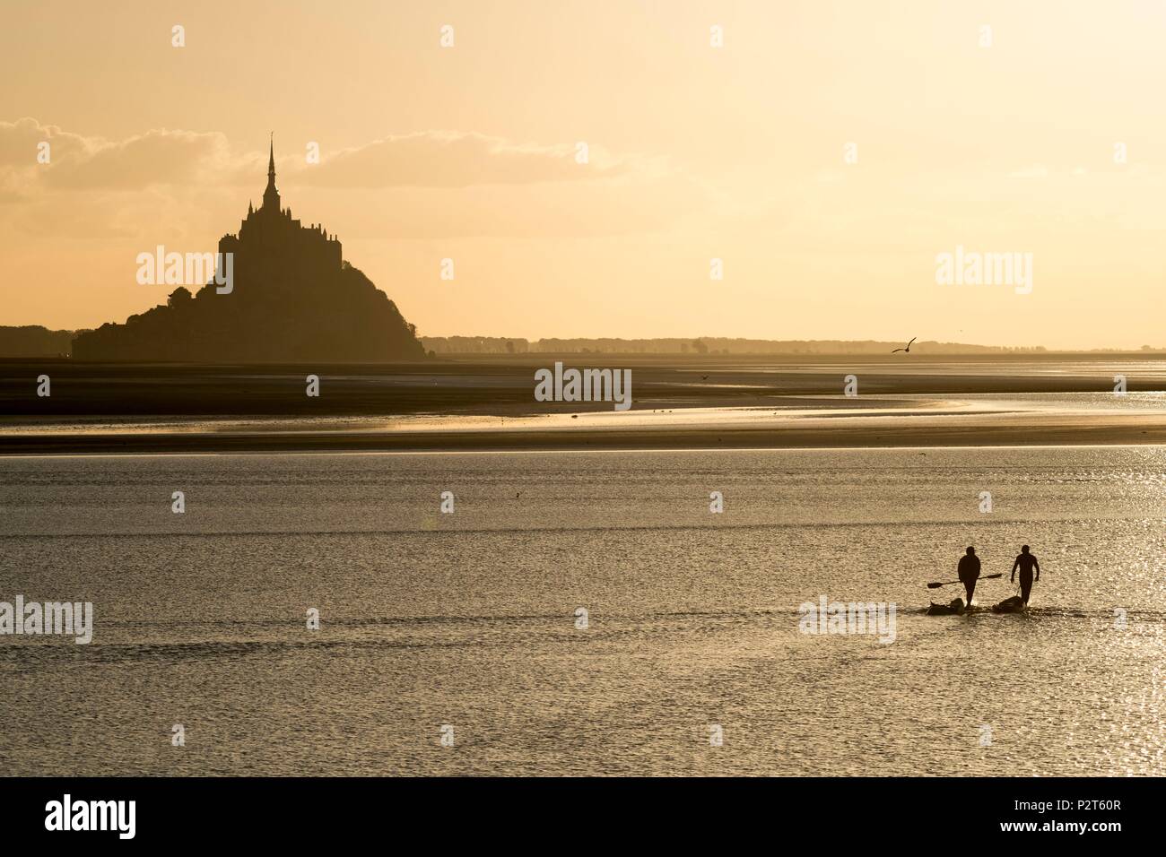 France, Manche, Mont Saint Michel Bay listed as World Heritage by UNESCO, Abbey of Mont Saint Michel at sunset, rising tide Stock Photo