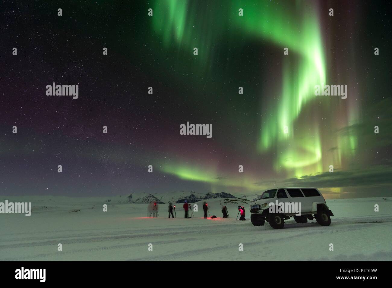 Iceland, East Iceland, Vatnajokull National Park, photographers under an aurora borealis Stock Photo