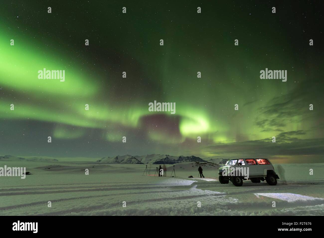Iceland, East Iceland, Vatnajokull National Park, photographers under an aurora borealis Stock Photo