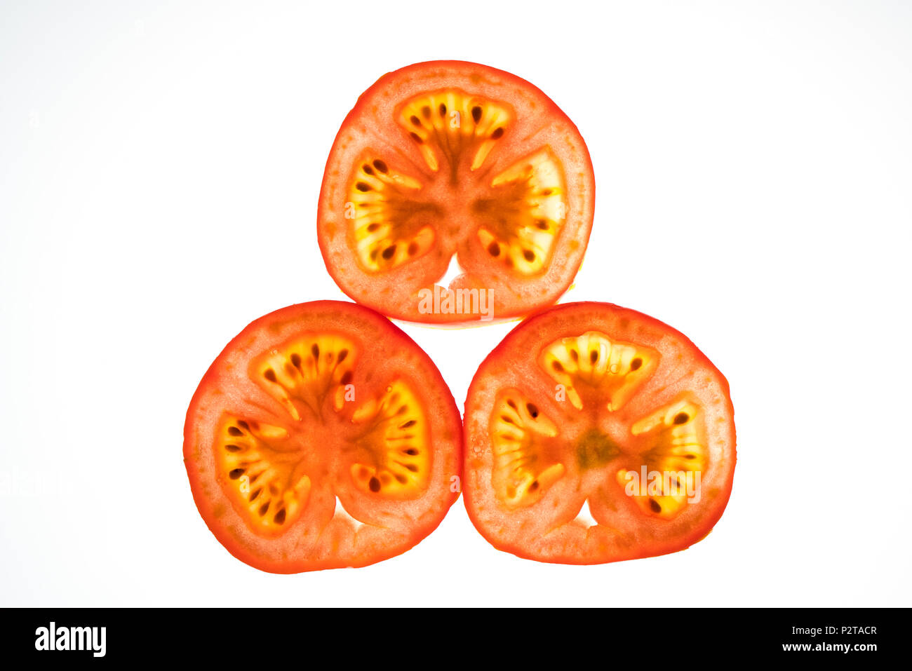 tomato slices lit from the back Stock Photo
