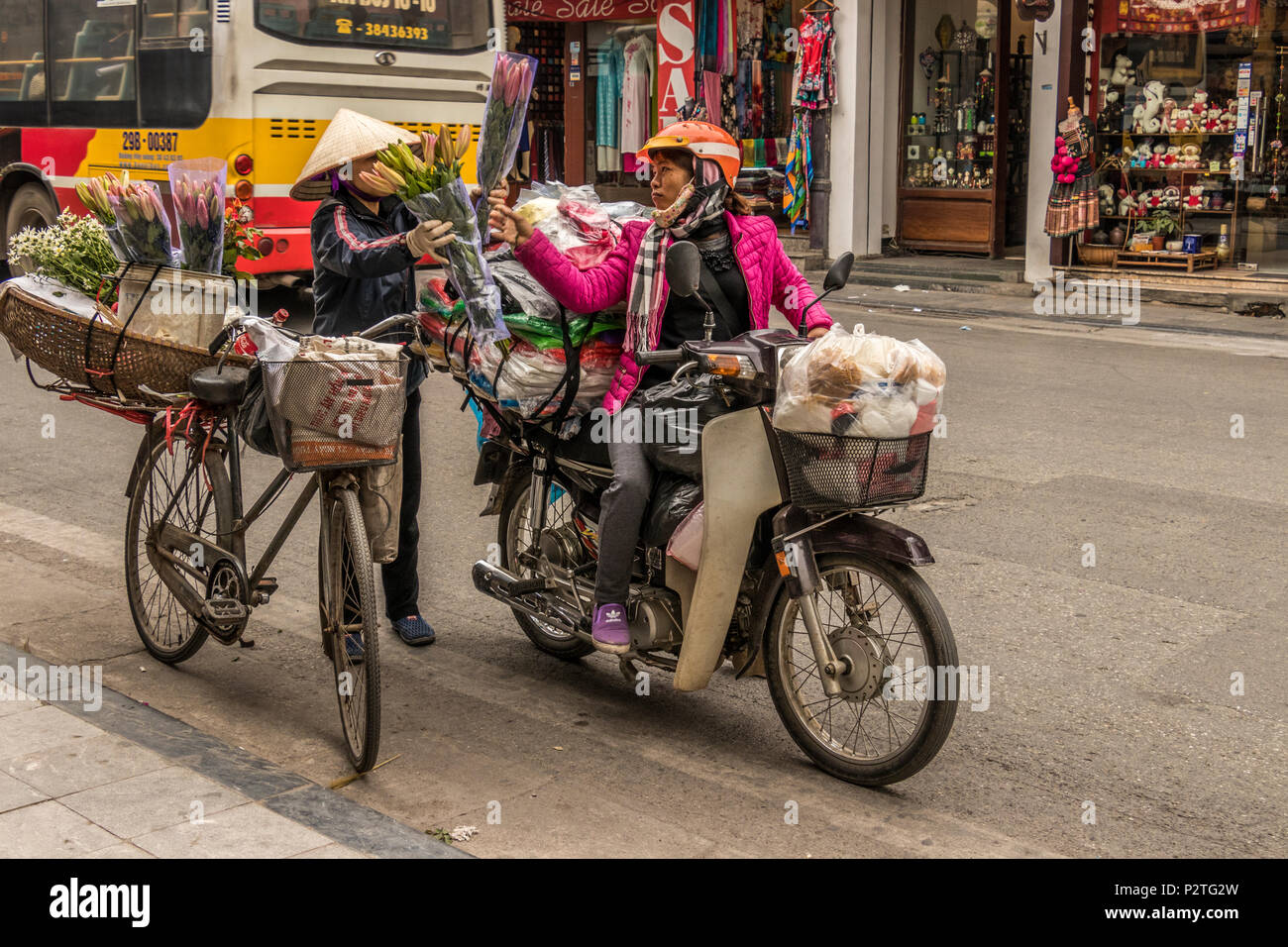 Vendors one foot,motorcyce and cycle in Hanoi Vietnam Stock Photo