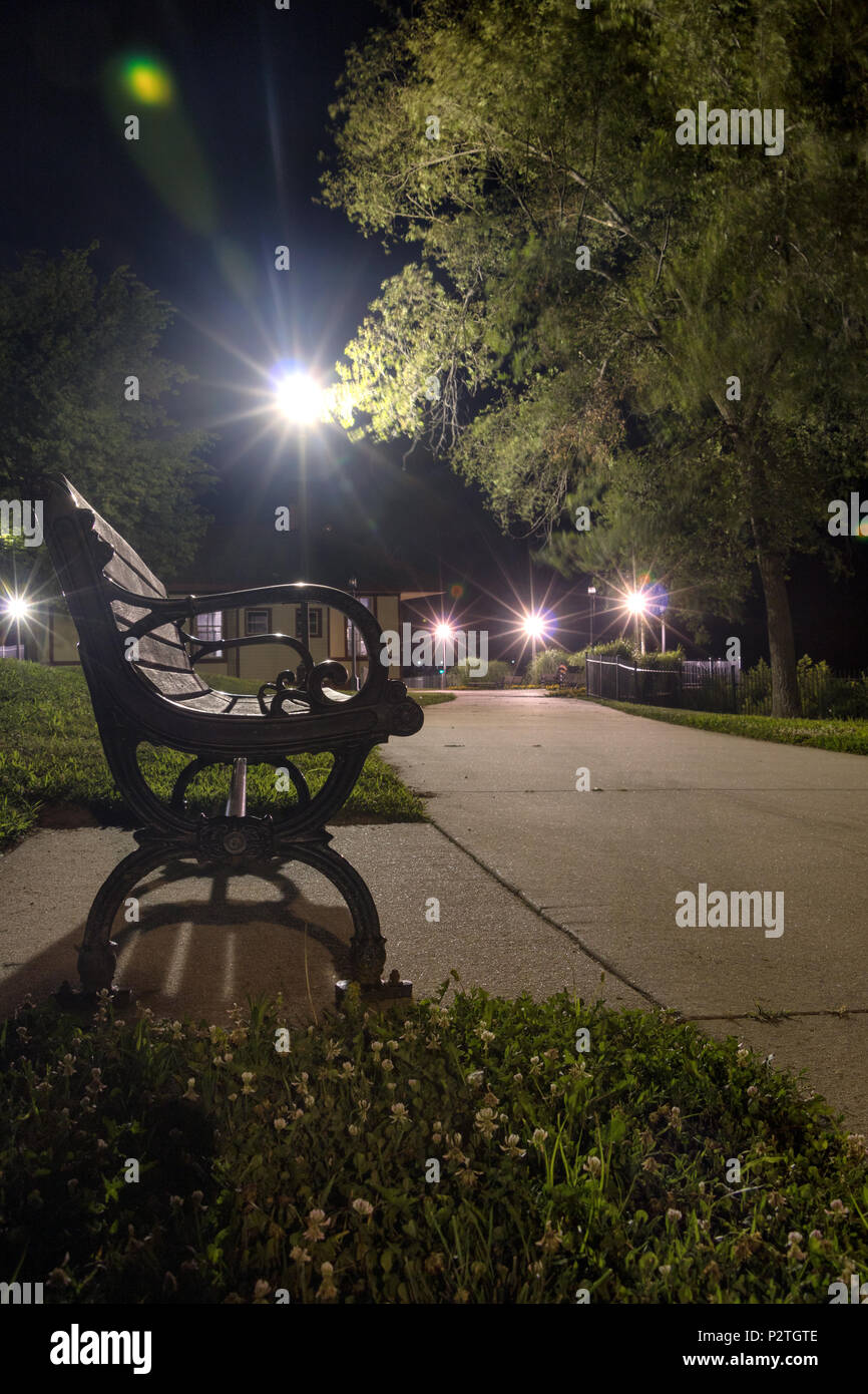 park at night with benches and lights Stock Photo
