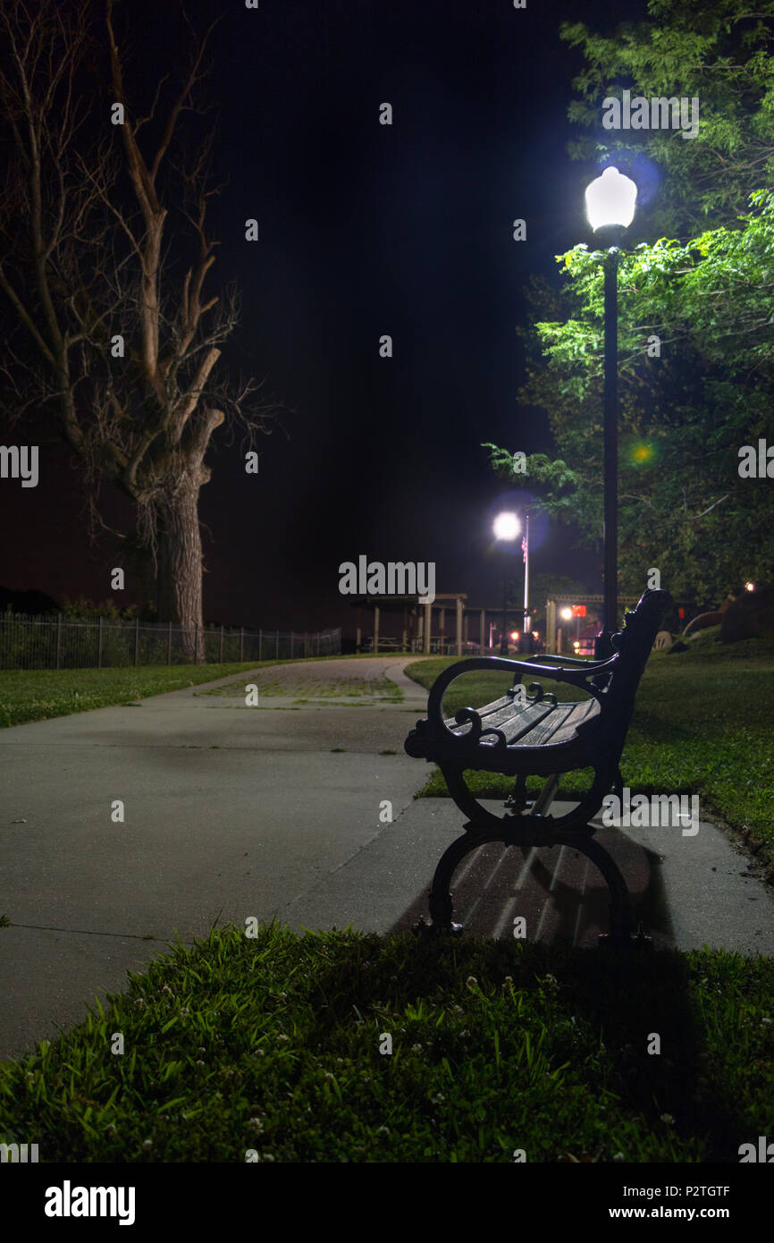 park at night with benches and lights Stock Photo