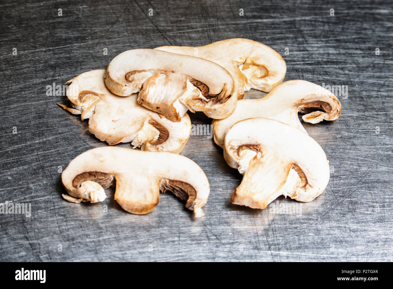 Sliced Mushrooms on a stainless steel background Stock Photo
